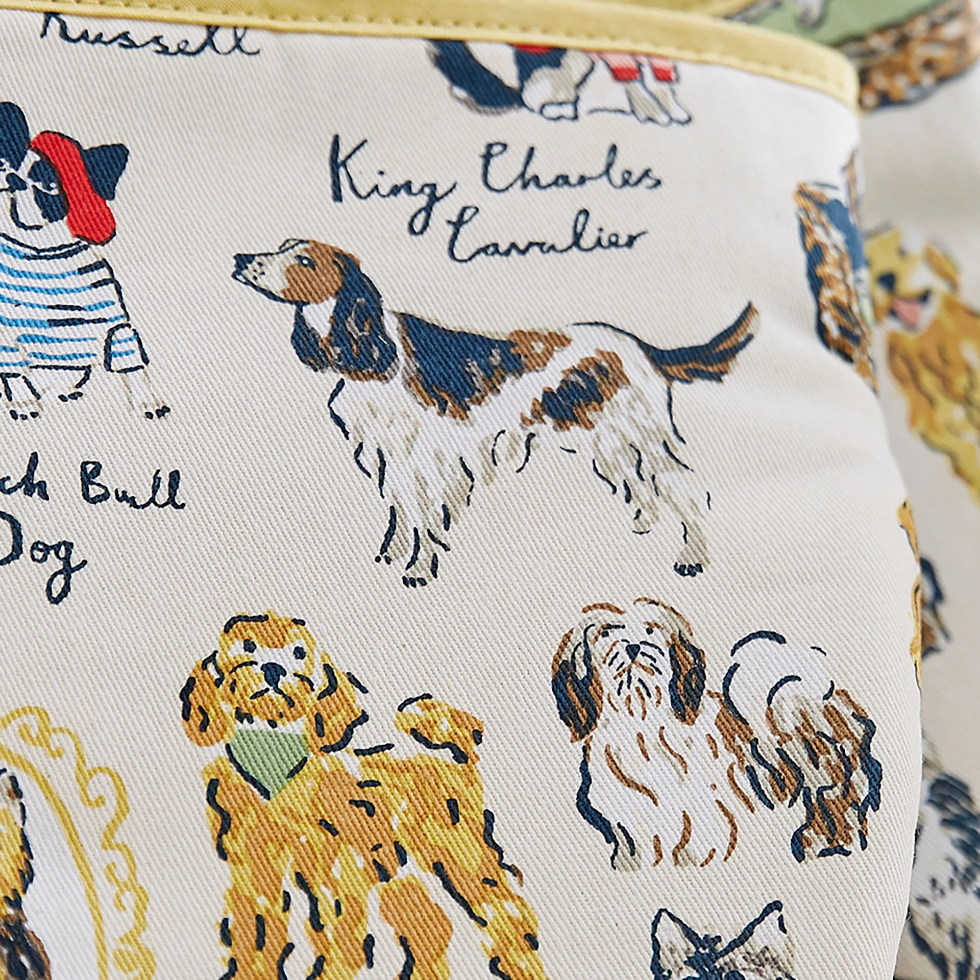 microwave mitts with various breeds of dog on them