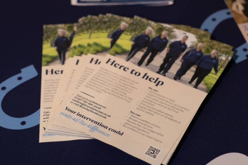 Here to help leaflets on a table
