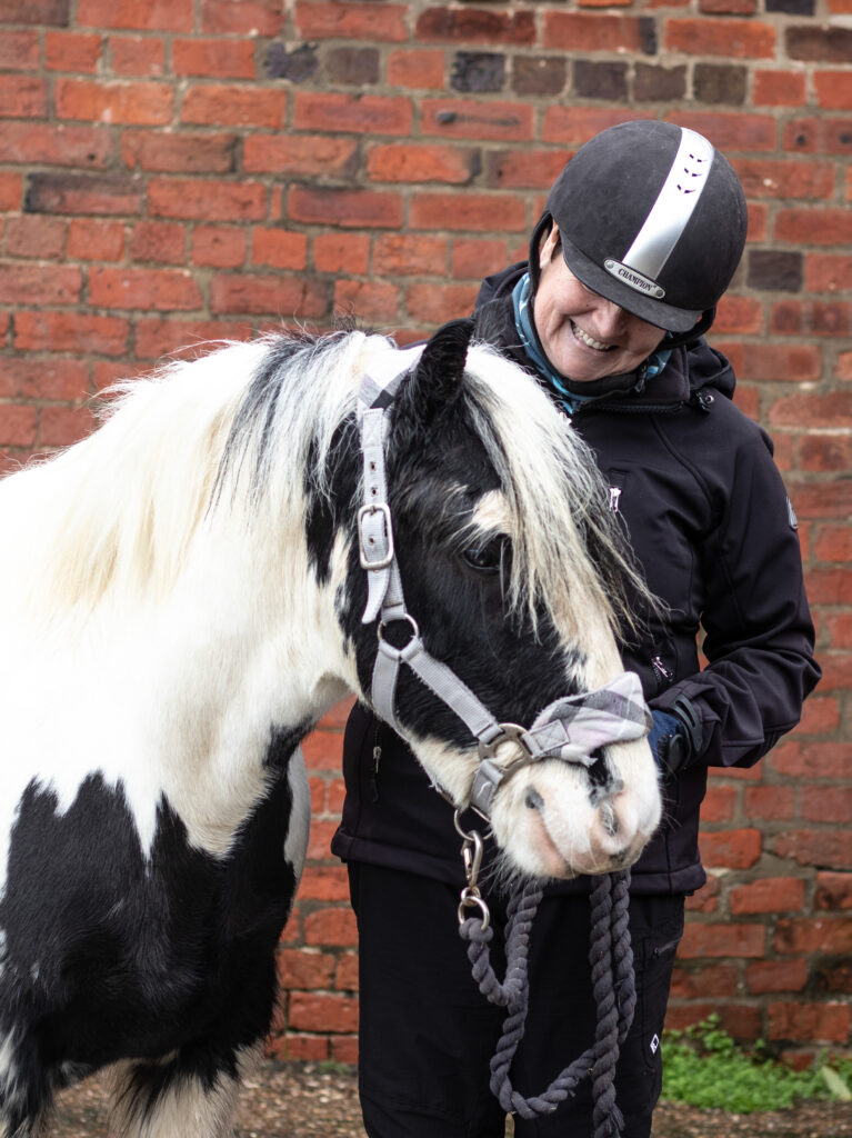 Fosterer stood with black and white cob