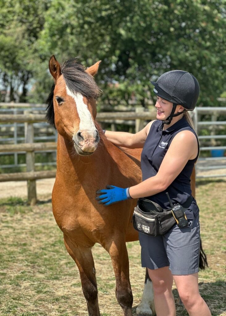 handler megan stood next to bay pony King fergus